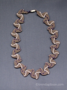 Ply-split double reverse, neutral/ white/ purple dashes. Standard size.  SOLD